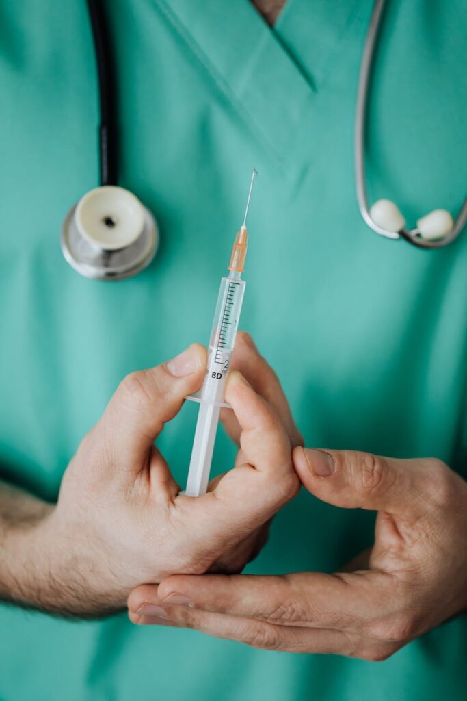 person holding a vaccine