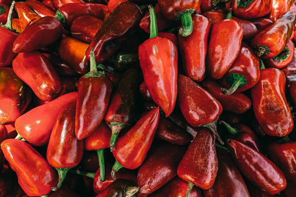 red bell pepper lot in close up photography